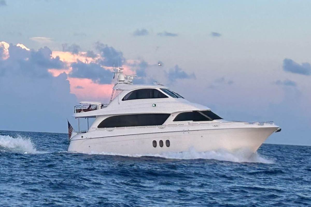 72-foot Hatteras Enclosed Bridge motor yacht profile showing full exterior starboard side with enclosed pilothouse and dua...