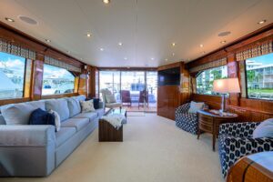 72-foot Hatteras Enclosed Bridge flybridge with hardtop, radar arch, and dual helm stations overlooking the Key Largo wate...