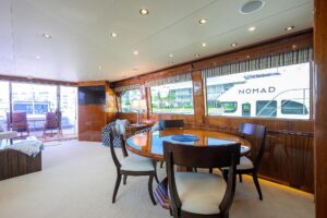72-foot Hatteras Enclosed Bridge yacht helm station with Garmin electronics and dual helm chairs in Key Largo.