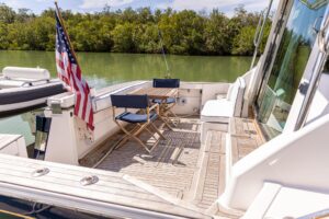 Sabre 52 Express helm station with dual Garmin displays, leather helm seating, and forward salon visibility through windsh...