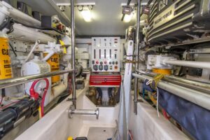 Sabre 52 Express helm station with dual Garmin displays, leather helm seating, and forward cabin visibility through windsc...