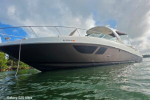 2010 Sea Ray Sundancer 370 cabin cruiser interior salon with upholstered seating and ambient lighting.