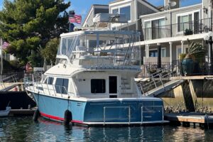 2012 Mikelson 43 Sportfisher bow view showing forward seating and cabin profile at Huntington Beach.