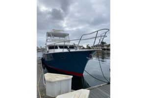 2012 Mikelson 43 Sportfisher 48-foot bow profile showing forward seating and cabin entry in Huntington Beach.
