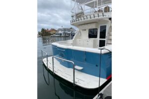 2012 Mikelson 43 Sportfisher transom with swim platform and outrigger deployment system.