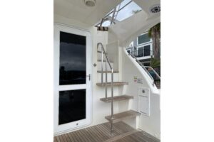 2012 Mikelson 43 Sportfisher cockpit with fighting chair, outriggers, and transom livewell in Huntington Beach.