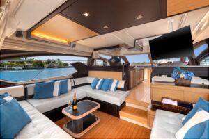 Bow seating area of 2013 Azimut 64 with forward lounge and cushioned seating overlooking the water.
