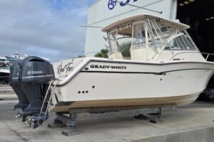 Grady-White Express 330 center console bow seating with forward windscreen and integrated cushioning.