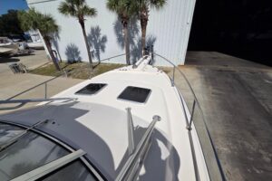 Grady-White Express 330 helm station with dual Garmin displays, center console steering, and forward visibility through wi...