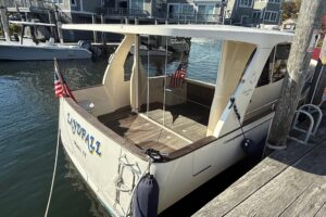 Greenline 33 hybrid yacht cabin interior with forward seating area and natural light from windows