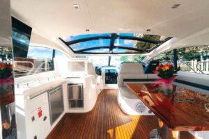 Bow view of 2014 Sunseeker Predator 60 luxury yacht showing forward seating and cabin entry in Chicago.