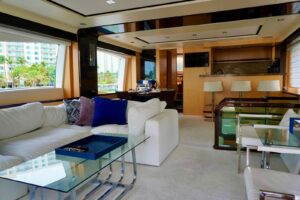 Stern view of 2015 Azimut 84 motor yacht showing transom, swim platform, and teak cockpit seating in Aventura, Florida.