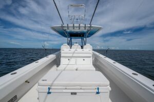 Bahama 41 cabin cruiser helm station with dual helm seats, center console steering, and forward windscreen in Coral Gables.