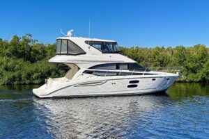 Bow seating and forward cabin entry on a 2015 Meridian 441 Sedan sedan cruiser.