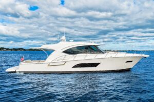 Bow seating area of 2015 Riviera 565 SUV with forward-facing lounges and cushioned upholstery overlooking the water.