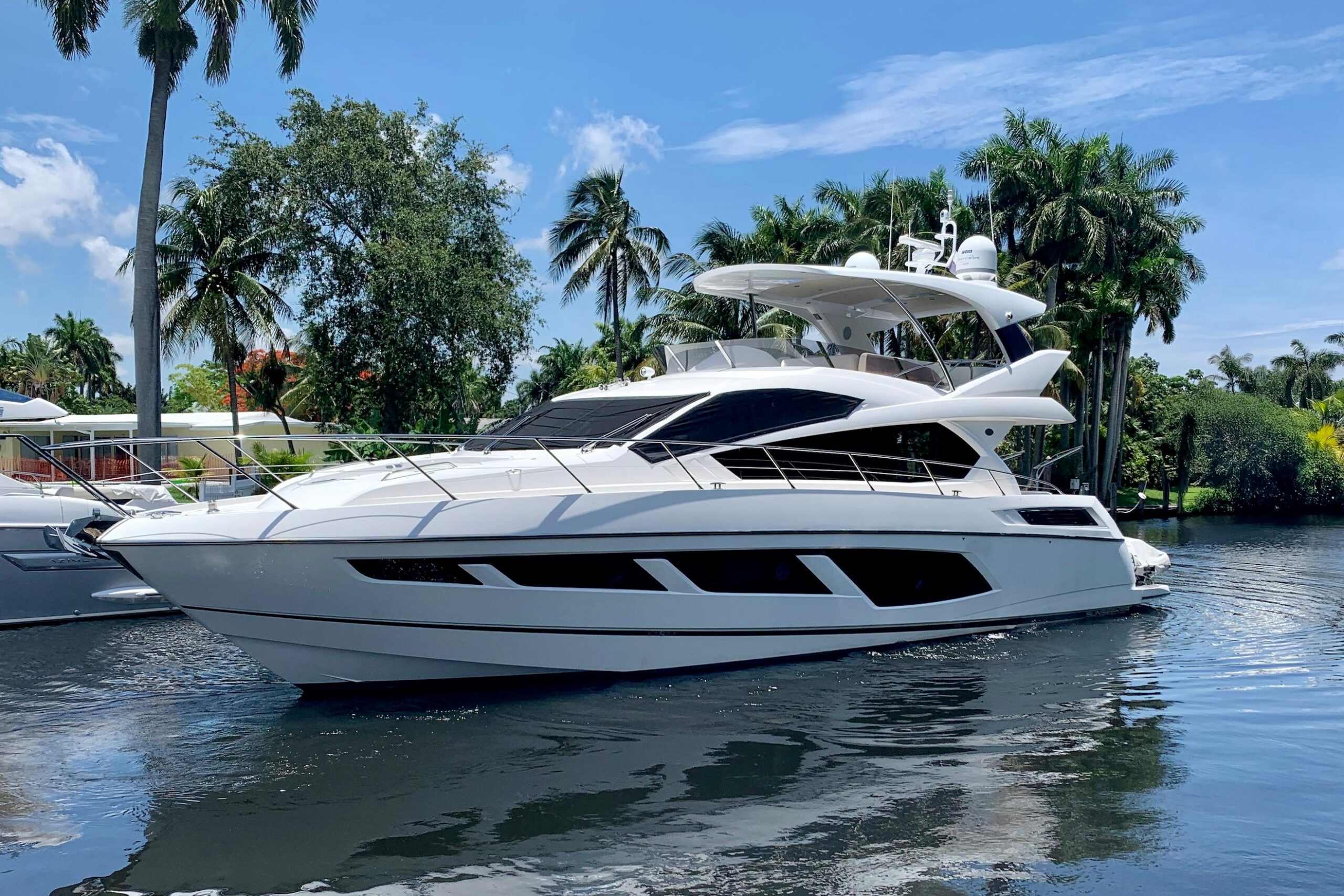 2016 Sunseeker Manhattan 65 motor yacht exterior profile showing full starboard side with flybridge and hardtop in Boston.