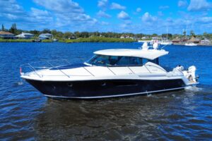 2016 Tiara Yachts C44 Coupe 45.5-foot hardtop cruiser with twin outboard engines moored at New Smyrna Beach, Florida.