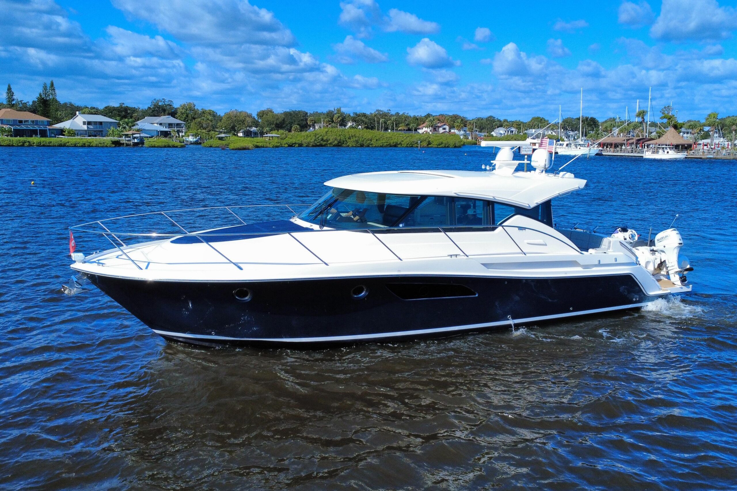2016 Tiara Yachts C44 Coupe 45.5-foot hardtop cruiser with twin outboard engines moored at New Smyrna Beach, Florida.
