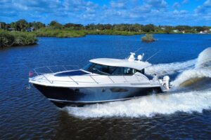 2016 Tiara Yachts C44 Coupe bow section with forward seating and windshield detail.