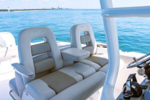 Helm station of 2017 Boston Whaler 330 Outrage with dual Garmin displays, center console steering, and forward visibility ...
