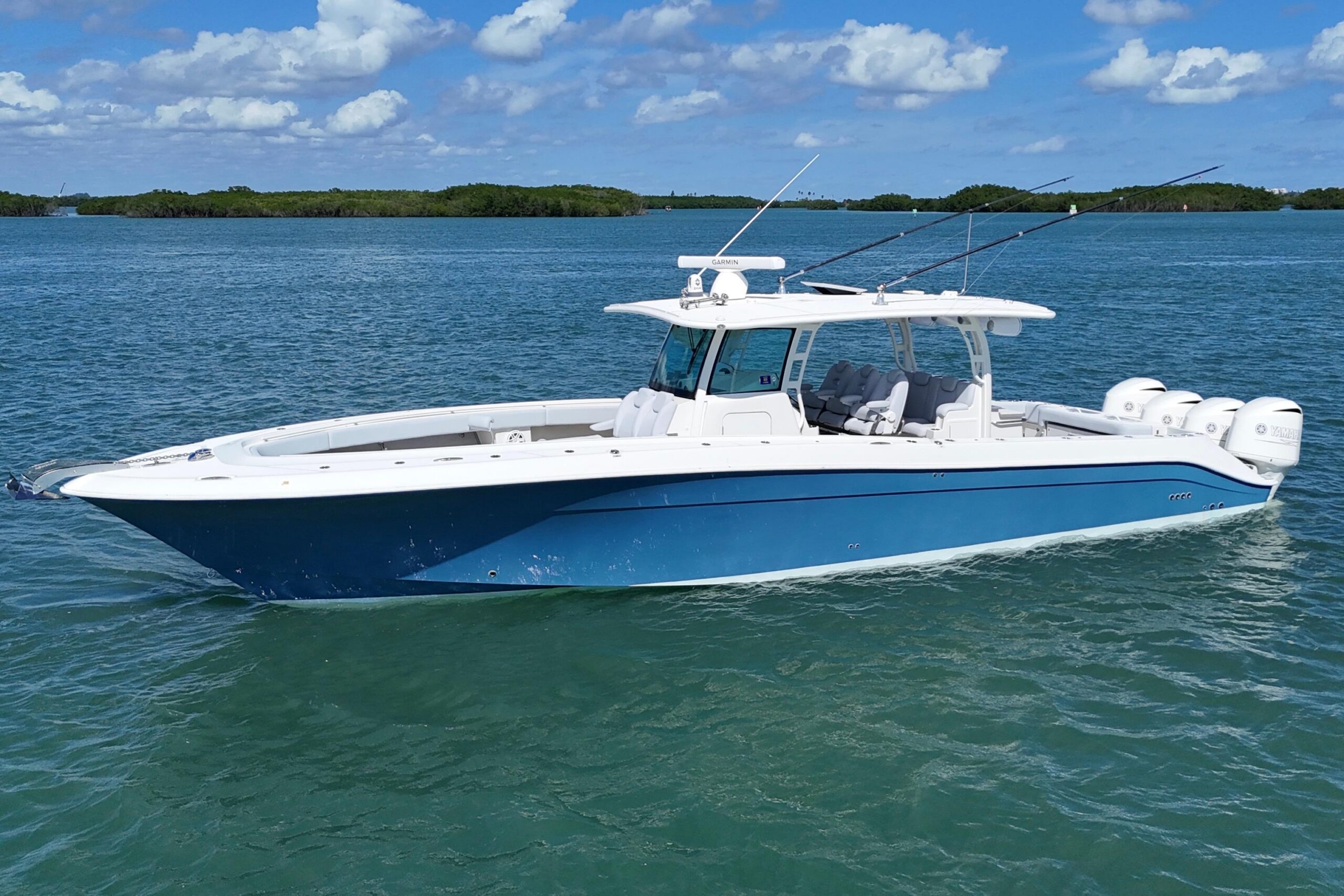 2017 HCB 42 Siesta center console yacht profile showing hardtop, helm station, and outboard engines in Fort Pierce, Florida.