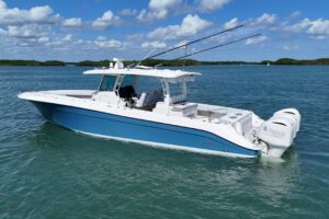 Stern view of 2017 HCB 42 Siesta showing transom, swim platform, and cockpit seating with hardtop overhead.