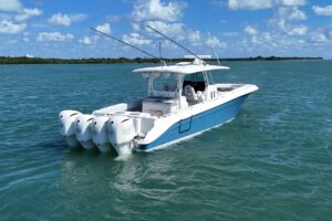 HCB 42 Siesta helm station with dual Garmin displays, center console steering, and forward visibility over the bow.