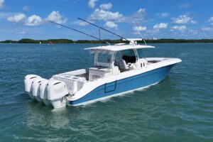 2017 HCB 42 Siesta center console helm station with dual Garmin displays, steering wheel, and forward visibility over bow.