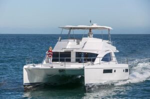 2017 Leopard 51 Powercat exterior profile starboard side showing twin hulls, hardtop, and helm station tower in Fort Laude...