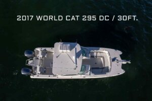 Helm station of 2017 World Cat 295 DC with dual helm seats, center console steering, and forward visibility through windsc...