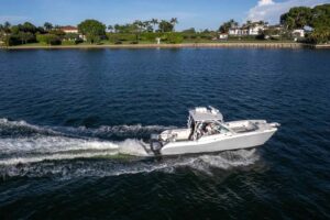 2017 World Cat 295 DC dual console catamaran helm station with Garmin electronics and steering wheel in Miami.