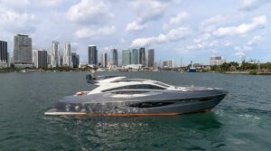 2019 Numarine 78 motor yacht helm station with dual helm chairs, steering wheel, and integrated Garmin navigation displays.