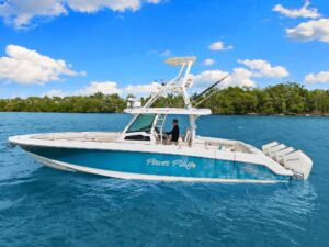Bow view of 2020 Boston Whaler 380 Outrage center console with forward seating and windshield.
