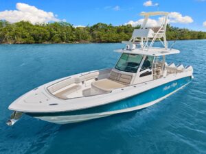2020 Boston Whaler 380 Outrage center console helm with dual Garmin displays, stainless steel wheel, and forward visibilit...