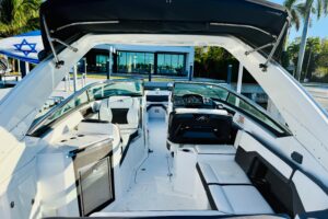 Helm station of 2020 Monterey 328SS Super Sport with dual Garmin displays, center console steering, and forward visibility...