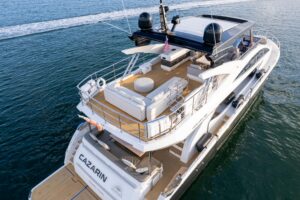 Bow view of 2020 Pearl 80 superyacht with teak foredeck and anchor setup in Miami.