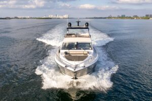 Pearl 80 yacht helm station with dual Garmin displays and center console steering in Miami.