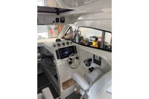 Bow view of 2020 Protector 310 Targa center console with forward seating and windscreen.