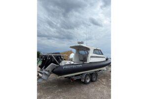 Bow seating and forward cabin entry on 2020 Protector 310 Targa center console fishing boat.