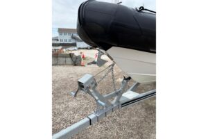Protector 310 Targa helm station with dual Garmin displays, steering wheel, and overhead hardtop with integrated electronics.