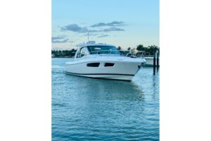 Bow view of 2021 Intrepid 410 Evolution center console with forward seating and windshield in Miami Beach.