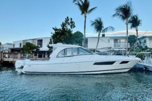 Bow seating and forward console of 2021 Intrepid 410 Evolution center console with cushioned seating and windscreen.