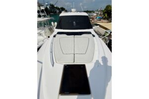 2021 Intrepid 410 Evolution center console helm station with dual Garmin displays, steering wheel, and forward visibility ...