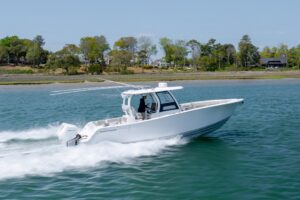 Bow seating and anchor locker on 2021 Sportsman Open 322 center console with forward cushioned seating and stainless steel...
