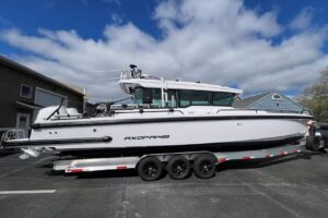 2022 Axopar 37 XC Cross Cabin starboard profile showing full-length exterior with hardtop and helm station forward.