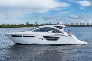 2022 Cruisers Yachts 54 Cantius motor yacht profile starboard side view showing full exterior with hardtop and twin outboa...