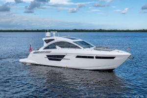2022 Cruisers Yachts 54 Cantius bow seating and forward cabin entry with curved windscreen and stainless steel railings.