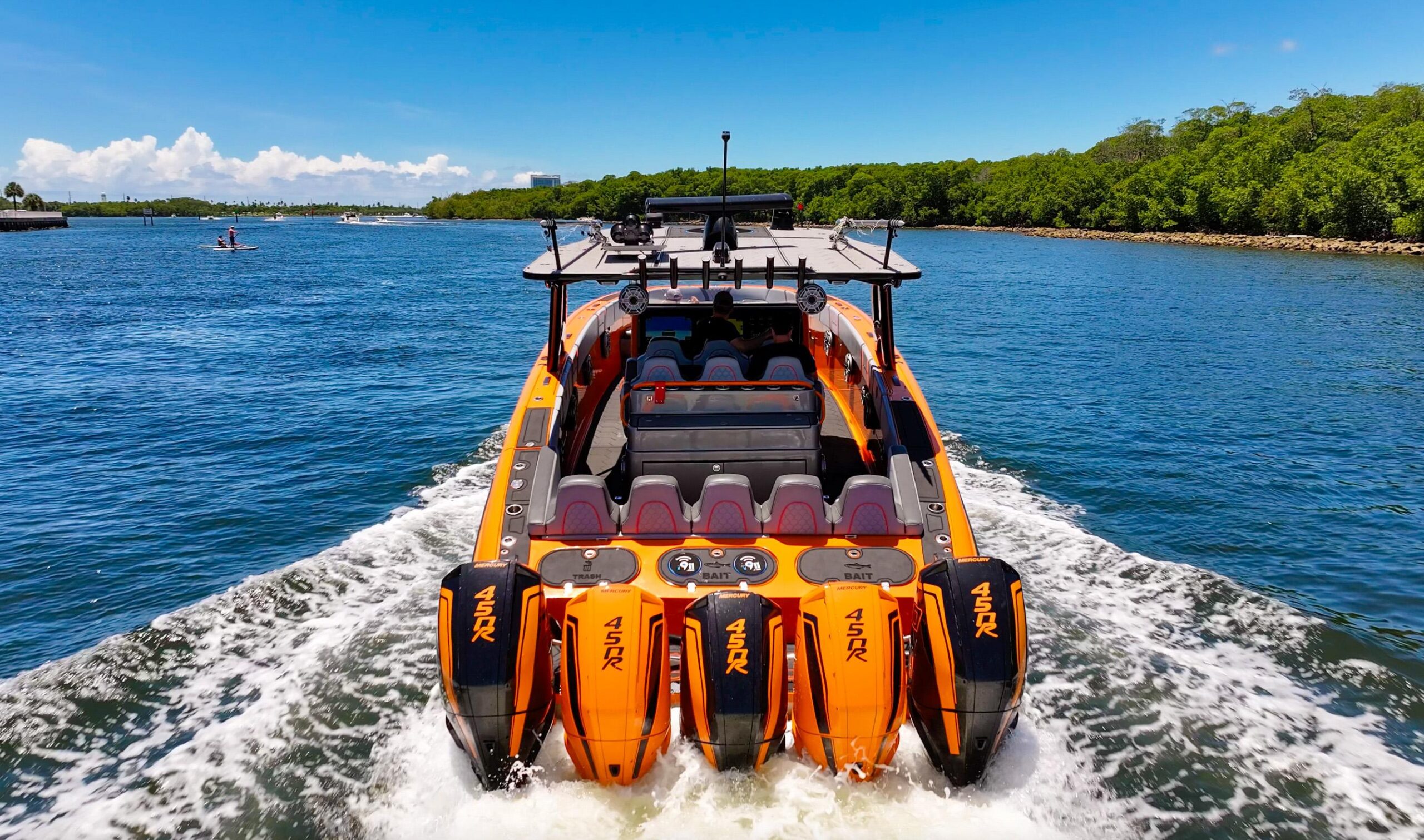 2022 Midnight Express 43 Open center console profile starboard side with triple outboard engines and hardtop tower in Miami.