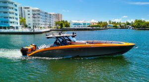 2022 Midnight Express 43 Open center console helm station with dual Garmin displays and helm seating in Miami.