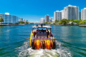 Midnight Express 43 Open center console helm station with dual Garmin displays, steering wheel, and throttle controls over...